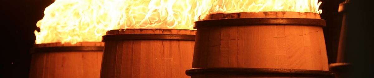 Barrels undergoing fire treatment